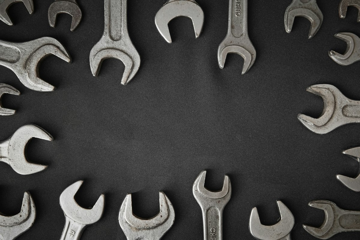 Open-ended spanners laid out on a dark surface